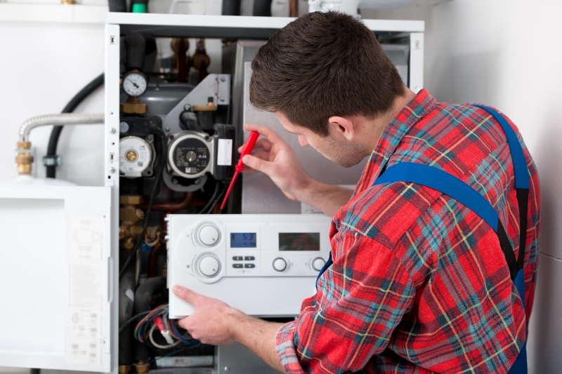Gas Safe engineer working on a boiler in Highgate